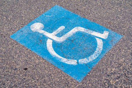 Disabled or Handicapped street sign on a cloudy dayの写真素材