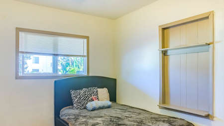 Panorama Lit bedroom with wood flooring and single bed. Wonderful California home in San Diego...