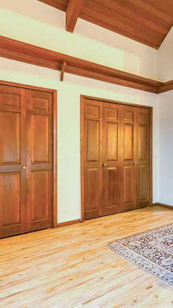 Vertical frame Bright, open and warm spare room with vaulted ceilings and poker table