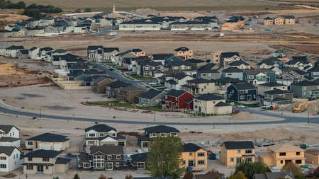 Panorama frame View of Utah Lake over a housing estate in the Utah Valley looking towards mountain peaks at sunriseの写真素材