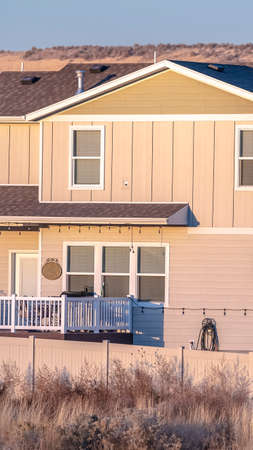 Vertical Backyard of traditional two story house in American town in Utah valley in winterの写真素材