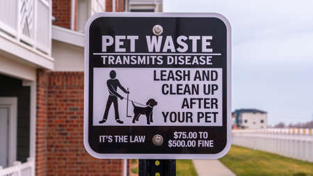 Panorama Pet Waste Transmits Disease warning notice or signpost at an apartment complex asking owners to clean upの写真素材