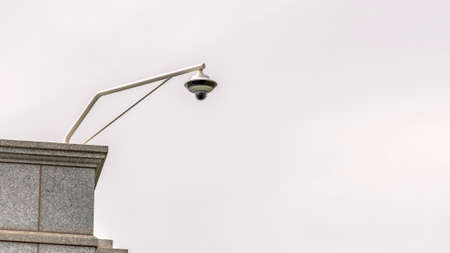 Panorama frame Outdoor cctv security camera installed at the corner of the roof of a building