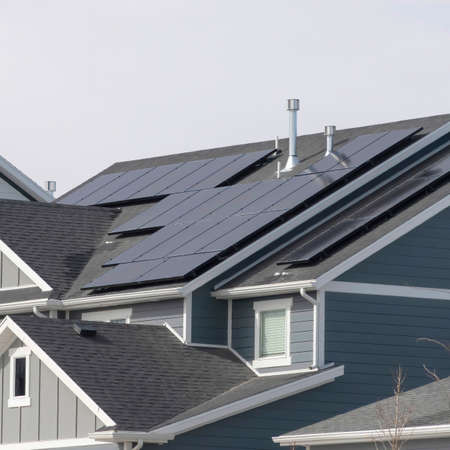 Square crop House exterior in South Jordan Utah with view of solar panels on the gray roof. Views at...