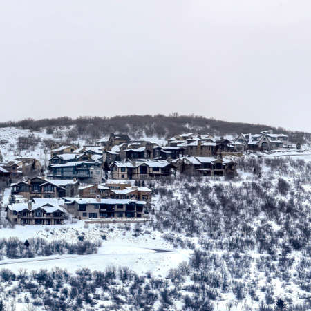 Square frame Mountain homes in Park City Utah with snowy nature landscape in winterの写真素材