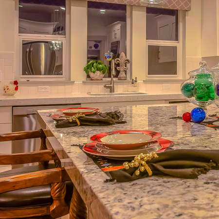 Square Table setting at the dining room of home with elegant furniture and tablewareの写真素材