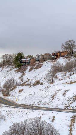 Vertical frame Homes on scenic mountain with panoramic views of snowy nature in Salt Lake Cityの写真素材