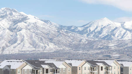 Panorama frame Neighborhood in South Jordan City in Utah overlooking Wasatch Mountains in winter....