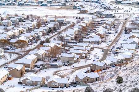 Aerial view of residential neighborhood on a white landscape of fresh snowの写真素材