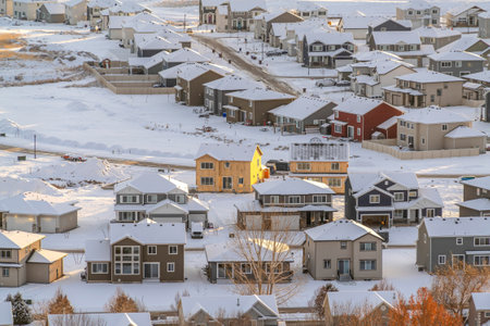Houses and roads of a residential neighborhood in the valley on a winter settingの写真素材