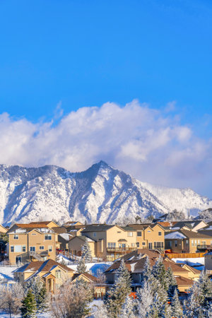 Amazing views of snowy mountain and cloudy sky in Highland Utah neighborhoodの写真素材