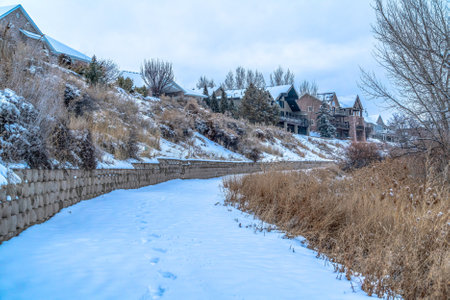 Houses around Utah Lake with views of a snow covered trail during winter seasonの写真素材