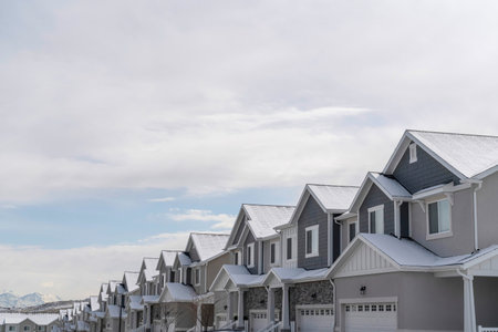 Beautiful homes on a suburb neighborhood with scenic lake and mountain viewsの写真素材