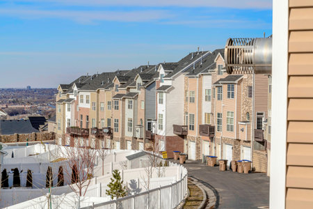 Utah Valley scenic neighborhood with townhouses against blue sky backgroundの写真素材