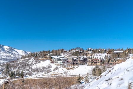 Scenic panorama of mountain homes on a winter setting in Park City communityの写真素材