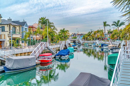 Canal with stairs and boat docks in the beautiful Long Beach CA neighborhoodの写真素材