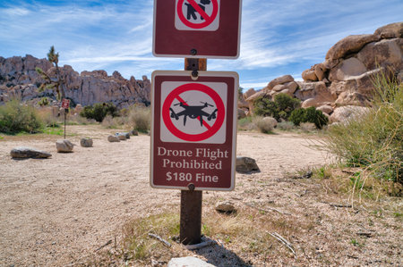 Drone Flight prohibited sign against desert rocks in Joshua Tree National Parkの写真素材