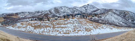 Villas on top of the hill between highway and mountain at Draper, Utah