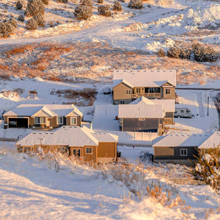 Square frame A lot of houses, roofs covered in snow in a valleyの写真素材