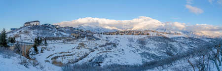 Mountainside residential community of Draper in Utah covered with snowの写真素材