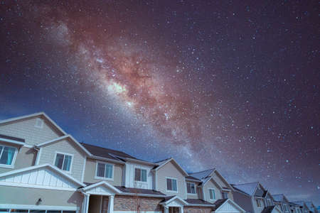 Complex houses against the composite milky way skyの写真素材