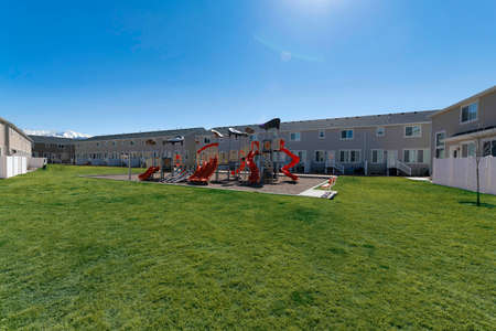 Playground on a field outside the complex buildings of townhouses at Utah