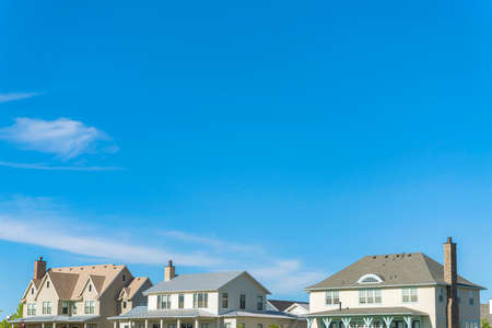 Second floor exterior of two-storey houses with different roof structures at Daybreak, Utahの写真素材
