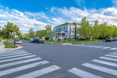 Crosswalk at the intersection road in a residential area at Daybreak, Utahの写真素材