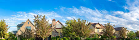 Panoramic residential houses with trees at the front in Daybreak, Utahの写真素材