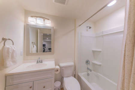Interior of a bathroom with white and light beige colorsの写真素材