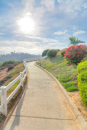 Concrete trail with railings on the edge of the slope at Southern Californiaの写真素材