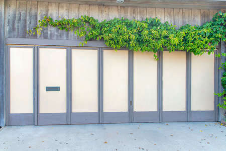 Closed bifold garage door with gray frames at Oceanside, Californiaの写真素材