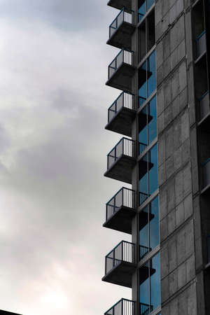 Side of a tall building with railings on the balconies at Salt Lake City, Utahの写真素材