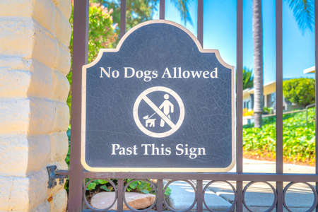 Signage on a railings with no dogs allowed sign at San Marcos, San Diego, Californiaの写真素材