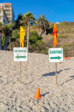 Surfing and swimming signboard at the beach in San Clemente, Californiaの写真素材