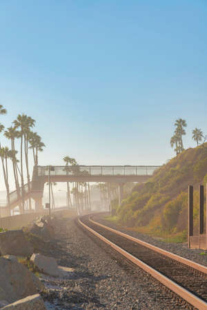 Train track at San Clemente, California against the sunset sky backgroundの写真素材
