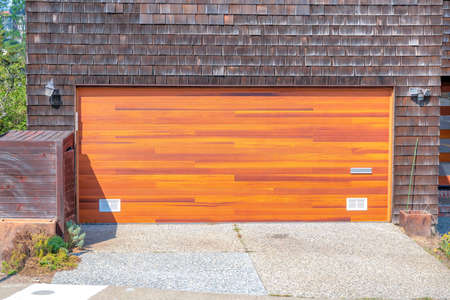 Garage exterior with wooden door and dark brown shingles sidings at San Francisco, Californiaの写真素材