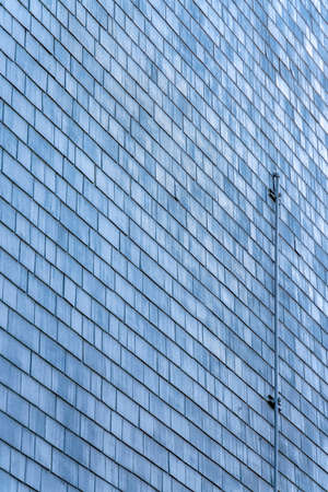 Concrete wall of a building in San Francisco, California with metal pipes outsideの写真素材
