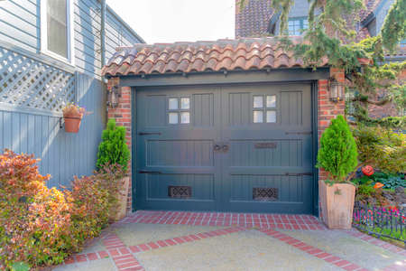French country style black side hinged garage door with concrete tiles roof at San Francisco, CAの写真素材