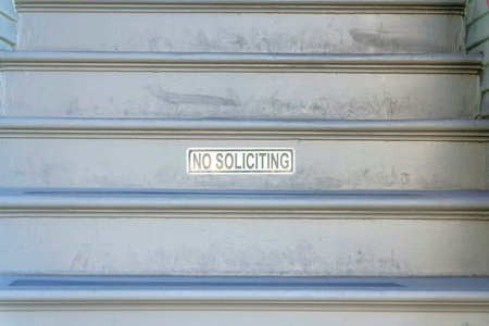 No soliciting sign at the riser of an outdoor stairs at San Francisco, Californiaの写真素材