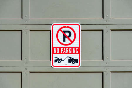 No parking sign with tow truck symbol at San Francisco, Californiaの写真素材