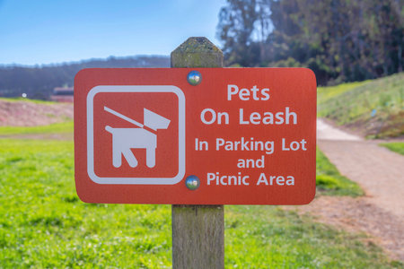 Pets on leash in parking lot and picnic area sign in San Francisco, Californiaの写真素材