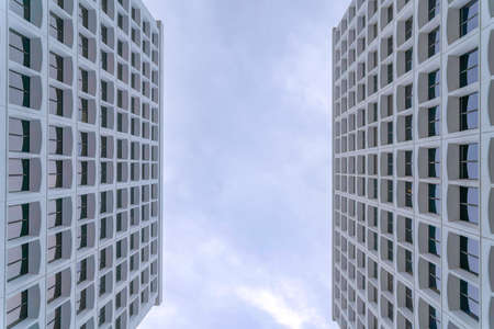 Tall buildings in a low angle view against the dark clouds in Silicon Valley, San Jose, Californiaの写真素材