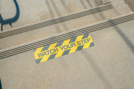 View of watch your step of a two step stairs from above in Tucson, Arizona