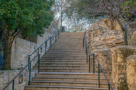 Outdoor stairway by the San Antonio River Walk in Texas on a beautiful day. The concrete steps with...