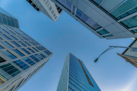 Austin Texas residential area with apartments exterior and street light pole. Looking up at flats and buildings with modern housing architecture design against blue sky background.の写真素材