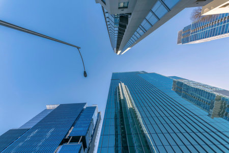 Austin, Texas- View of office and residential skyscraper buildings from below. There is a street...