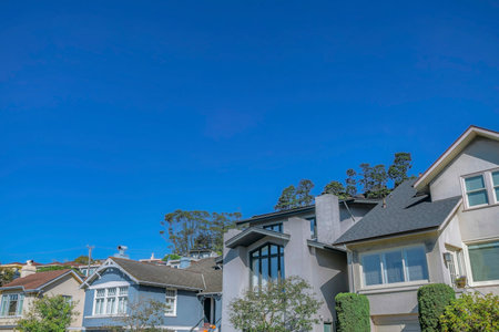 San Francisco California houses with gray and blue walls against clear sky. Residential landscape on a beautiful sunny day at a peaceful and quiet neighborhood.の写真素材
