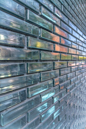 Austin, Texas- Close-up of a building wall with glass bricks in a running bond pattern. Building...