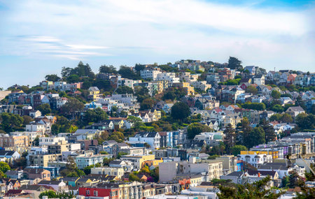 Rows of townhouses and apartment buildings on a sloped land in San Francisco, California. High angle...